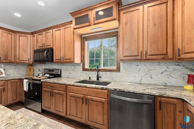 kitchen with backsplash, appliances with stainless steel finishes, dark hardwood / wood-style floors, and sink