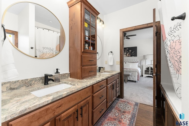 bathroom featuring hardwood / wood-style floors, ceiling fan, and vanity