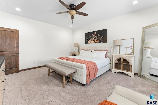 bedroom featuring light carpet and ceiling fan