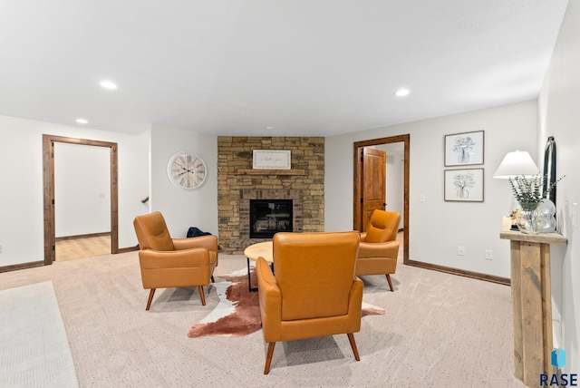 living room with light colored carpet and a fireplace