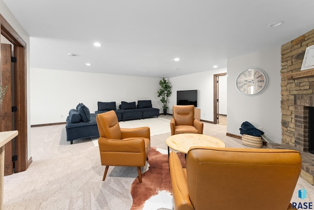 living room with a fireplace and light colored carpet