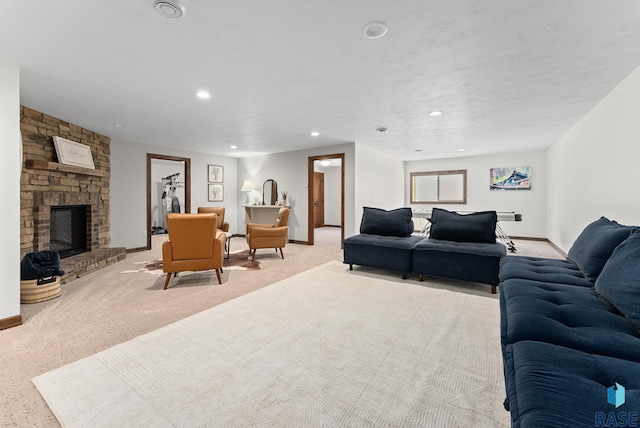 living room with a stone fireplace and light colored carpet