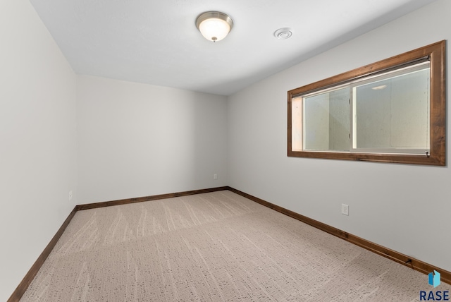 unfurnished room with carpet floors