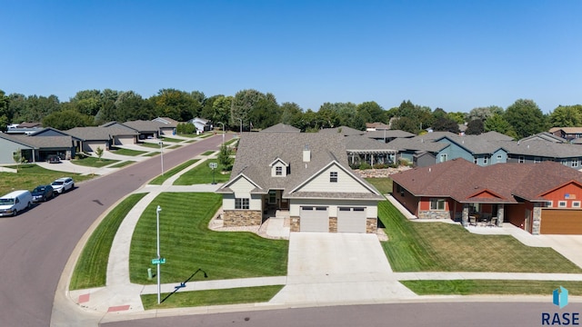 view of front of property featuring a garage and a front lawn