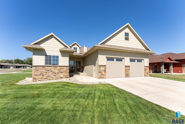 craftsman-style house with a front yard and a garage