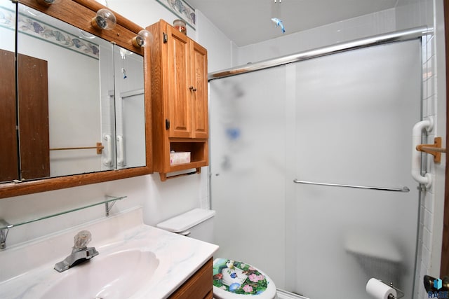 bathroom featuring walk in shower, vanity, and toilet