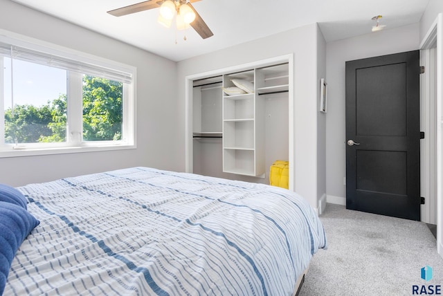 bedroom featuring carpet floors, ceiling fan, and a closet