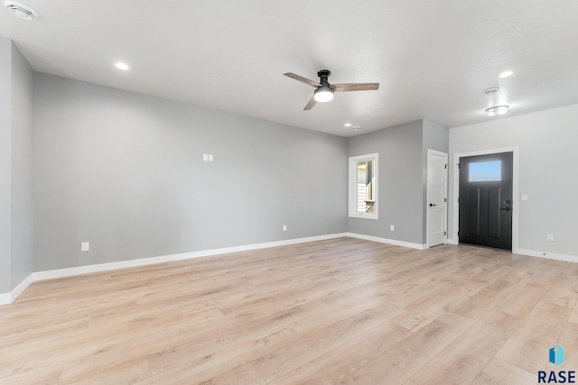 foyer entrance with light wood-type flooring and ceiling fan