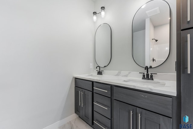 bathroom with walk in shower and vanity