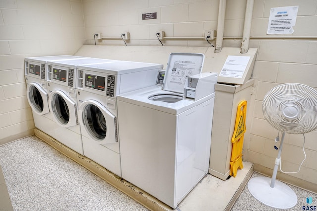 clothes washing area with washer and dryer