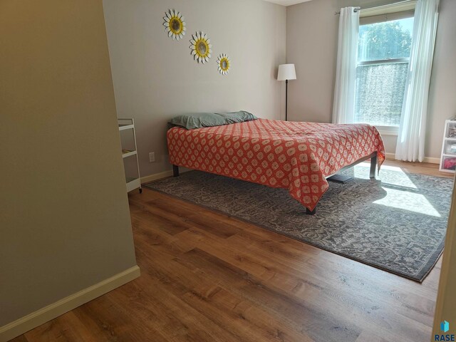 bedroom featuring dark hardwood / wood-style floors