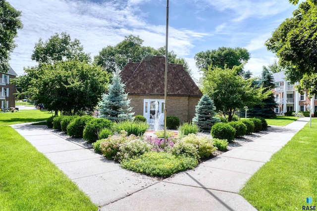 view of side of home featuring a lawn