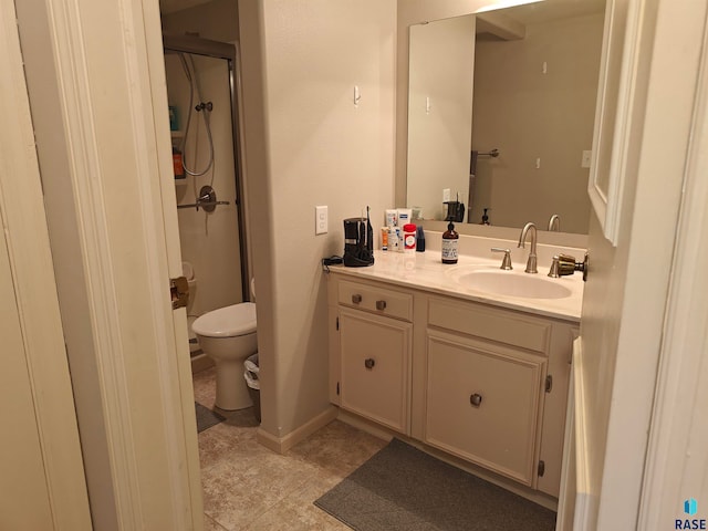 bathroom featuring a shower, vanity, toilet, and tile patterned floors