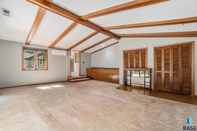 unfurnished living room featuring carpet, lofted ceiling with beams, a wall unit AC, and a wealth of natural light