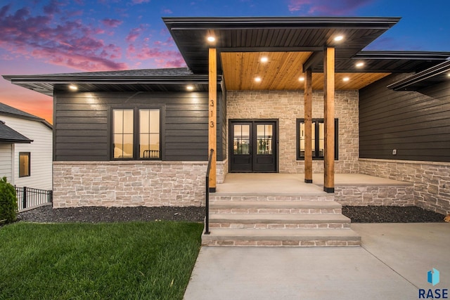 313 Red Spruce Ave, Sioux Falls, SD 57110 - doorway to property featuring french doors and stone siding