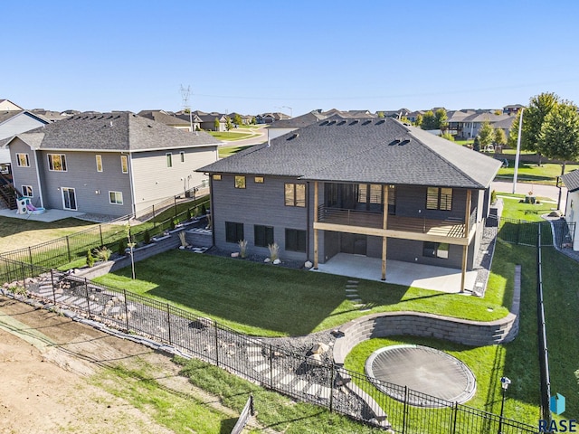 313 Red Spruce Ave, Sioux Falls, SD 57110 - rear view of house featuring a shingled roof, a yard, a fenced backyard, a patio, and a residential view