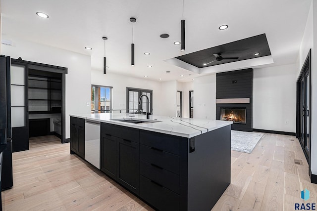313 Red Spruce Ave, Sioux Falls, SD 57110 - kitchen with dishwasher, a sink, open floor plan, a ceiling fan, and dark cabinetry