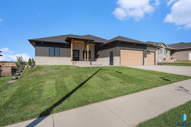 313 Red Spruce Ave, Sioux Falls, SD 57110 - prairie-style home featuring driveway, stone siding, a front yard, a garage, and fence