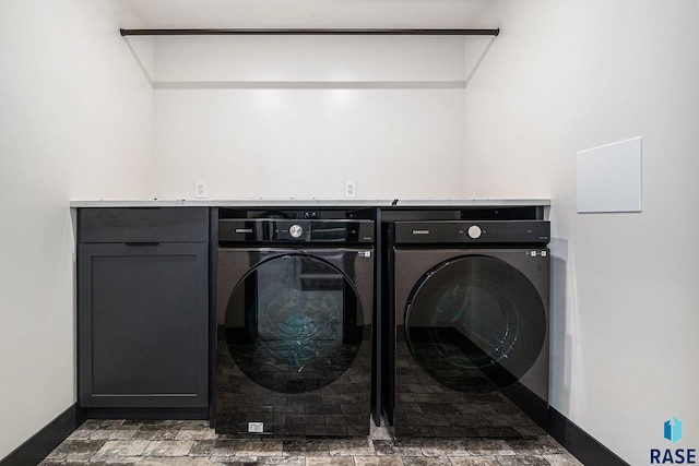 313 Red Spruce Ave, Sioux Falls, SD 57110 - laundry room with baseboards, cabinet space, and washing machine and dryer