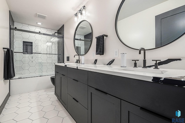 313 Red Spruce Ave, Sioux Falls, SD 57110 - full bathroom featuring enclosed tub / shower combo, double vanity, a sink, and visible vents
