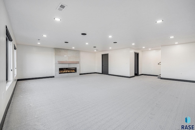 313 Red Spruce Ave, Sioux Falls, SD 57110 - below grade area with light carpet, recessed lighting, visible vents, and baseboards