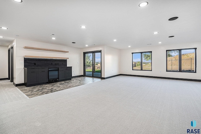 313 Red Spruce Ave, Sioux Falls, SD 57110 - unfurnished living room with recessed lighting, light colored carpet, and baseboards