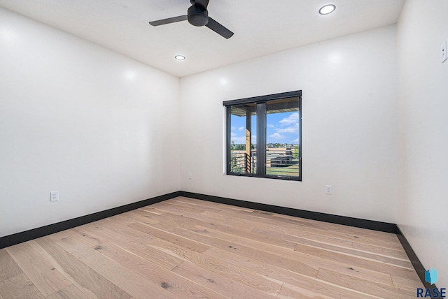313 Red Spruce Ave, Sioux Falls, SD 57110 - spare room with ceiling fan, recessed lighting, wood finished floors, and baseboards
