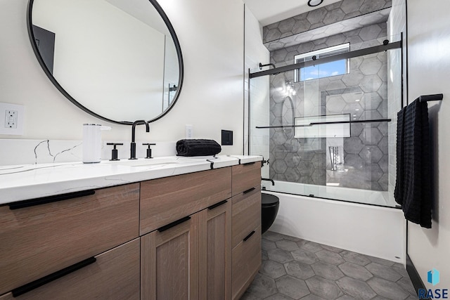 313 Red Spruce Ave, Sioux Falls, SD 57110 - bathroom featuring combined bath / shower with glass door, tile patterned floors, and vanity