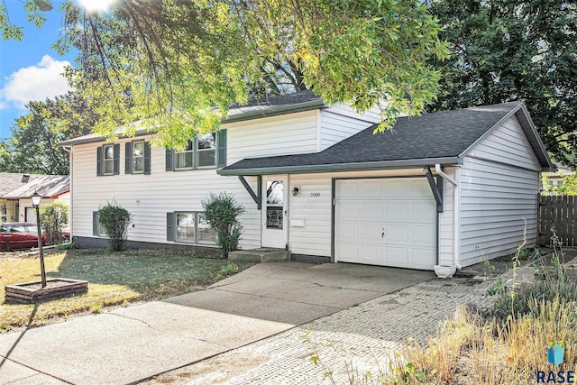 view of front of home featuring a front yard and a garage