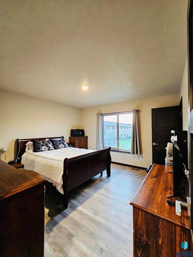 bedroom featuring light hardwood / wood-style flooring