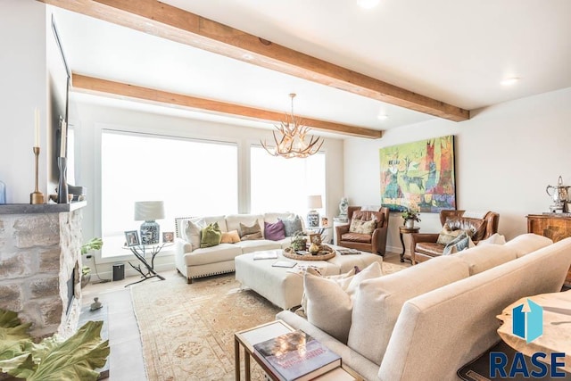 living room with a chandelier, beamed ceiling, and light tile patterned floors