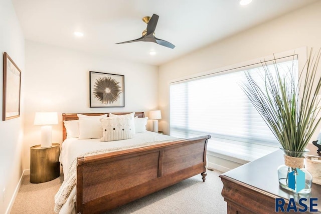 carpeted bedroom featuring ceiling fan