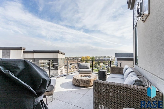 view of patio / terrace with a balcony and a grill