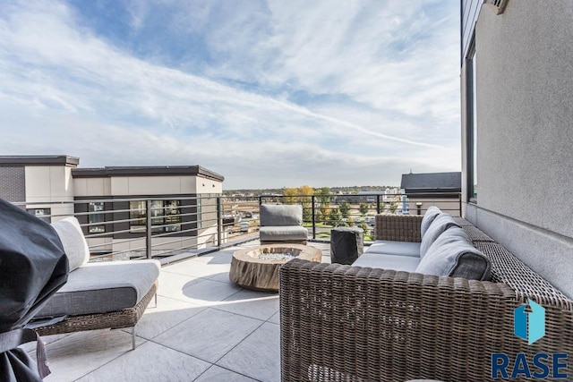 view of patio with a balcony and an outdoor living space