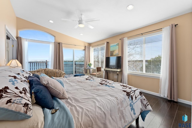 bedroom featuring multiple windows, dark hardwood / wood-style floors, ceiling fan, and access to exterior