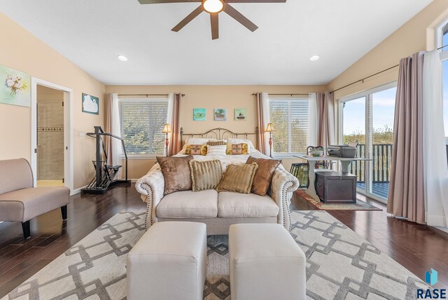 bedroom featuring lofted ceiling, dark hardwood / wood-style flooring, ceiling fan, and access to exterior