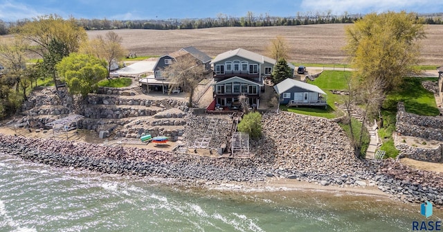 rear view of property with a water view