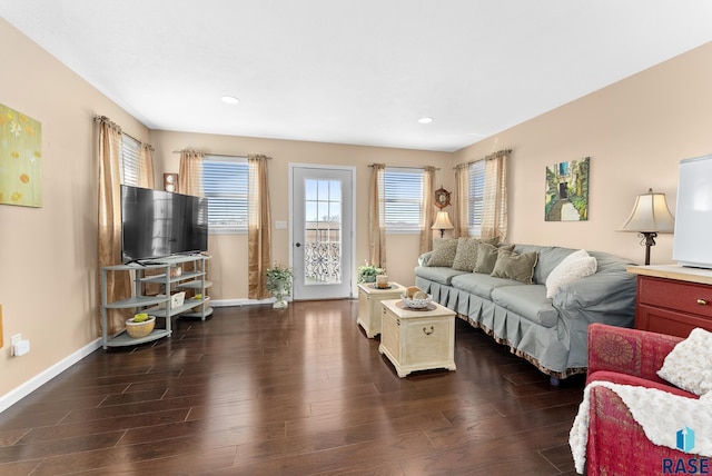 living room with dark hardwood / wood-style flooring