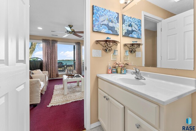 bathroom with ceiling fan and vanity