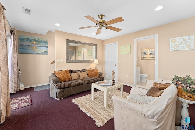 living room featuring ceiling fan and carpet flooring