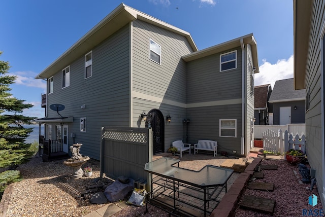 rear view of property featuring a patio