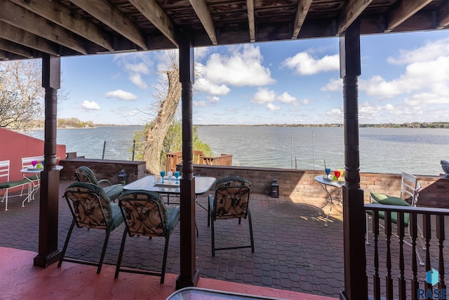 view of patio with a water view