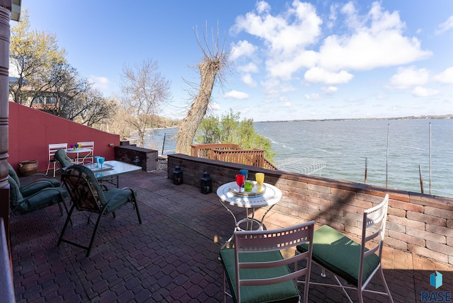 view of patio featuring a water view