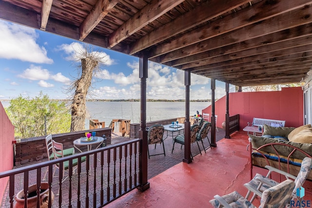 view of patio with a water view