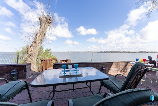 view of patio with a water view