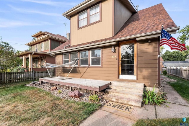 rear view of house with a lawn