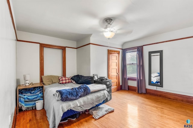 bedroom featuring light hardwood / wood-style floors and ceiling fan