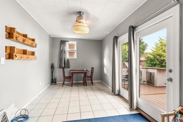 doorway with light tile patterned floors