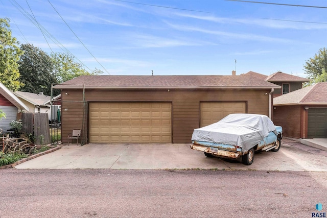 garage featuring wood walls