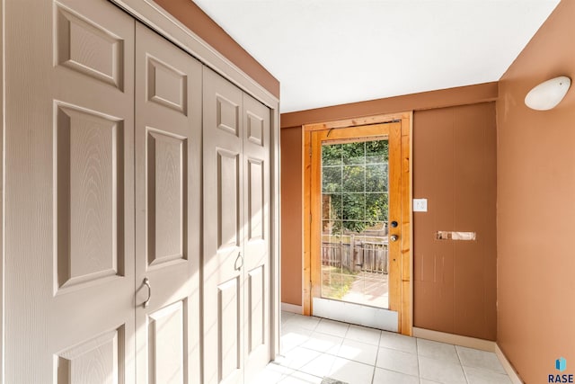 entryway featuring light tile patterned floors